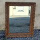 Antique mirror in patinated gilt wood
