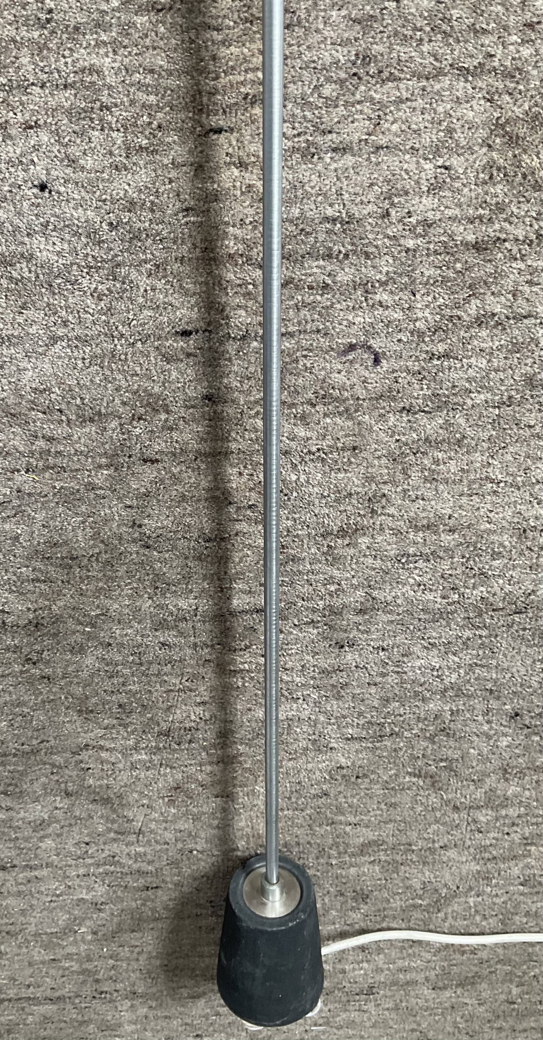 Minimalist floor lamp in cast iron and chrome metal