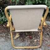 Rattan armchair and foldable canvas