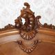 Walnut rocaille bed from the early 20th century.