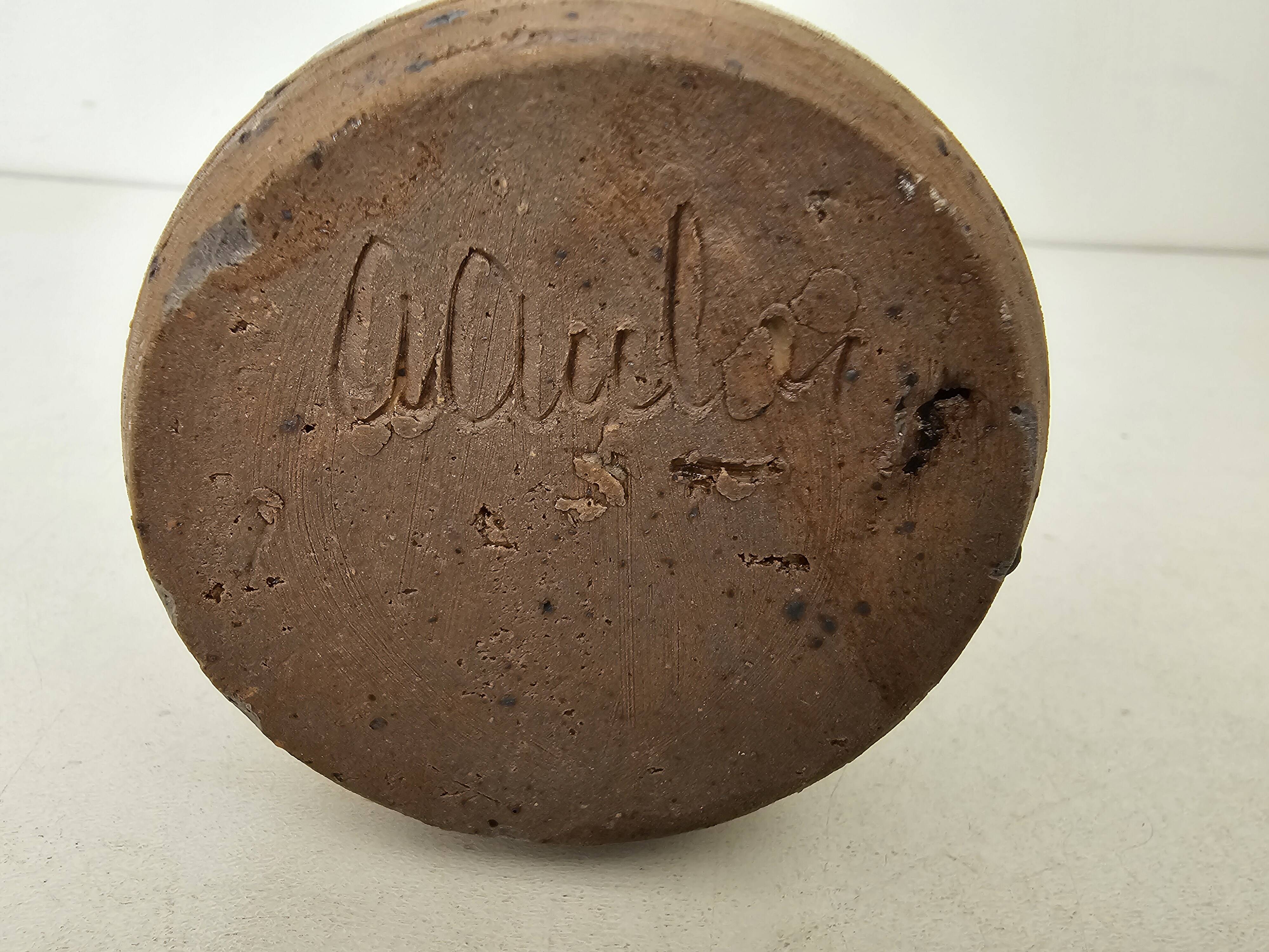 Pyrite stoneware single-flower vase in the shape of a bottle signed Aular?