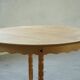 Round solid oak dining table with three extensions, mid-century Danish style, 1960s.