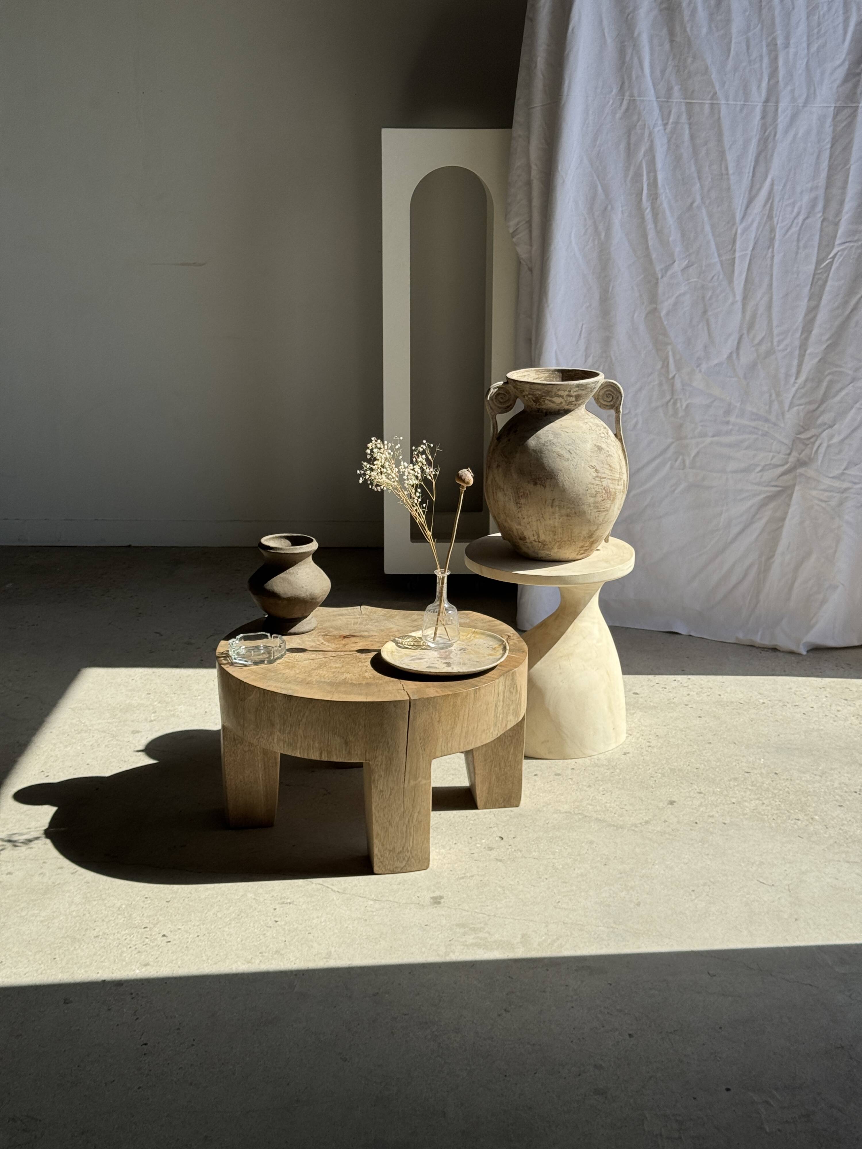 Petrified wood catchall or dish in beige with several grey spots in the centre.