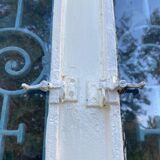 Entrance door in solid oak, cast iron grille, 1930s