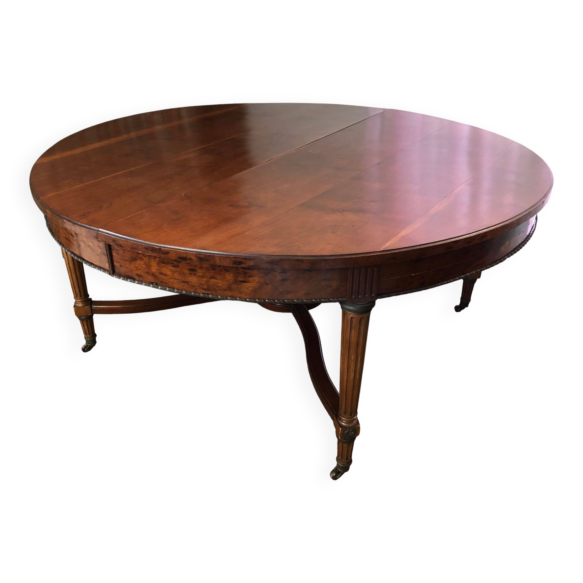 Important central pedestal table in mahogany, brass and bronze that can form a large dining table.