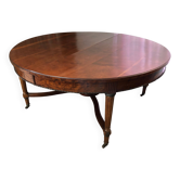 Important central pedestal table in mahogany, brass and bronze that can form a large dining table.