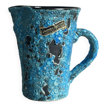 Blue glazed ceramic pitcher