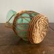 Glass pitcher and wicker