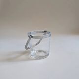 Clear glass ice bucket with an etched floral design