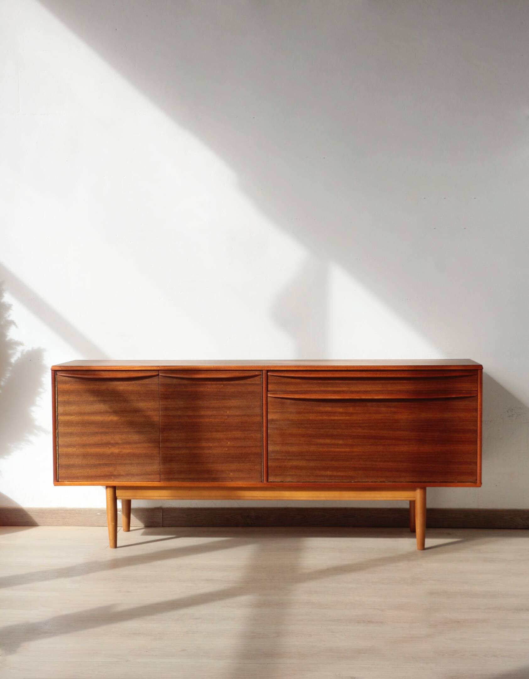 Vintage zebrano and walnut furniture from Morris of Glasgow.