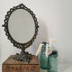 Old mirror on foot metal 30x46cm