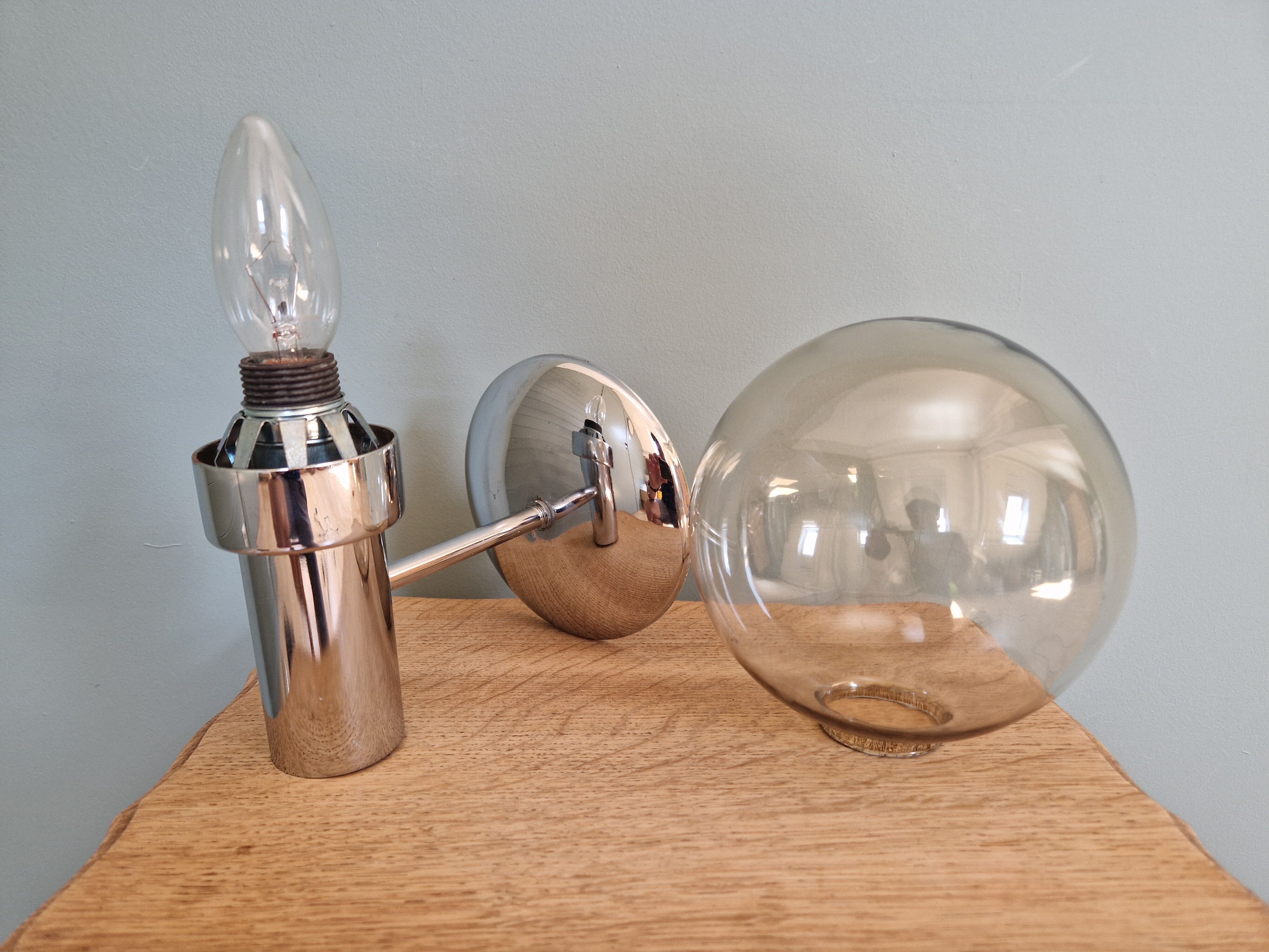Pair of vintage wall lights in chromed metal and smoked glass, 70s