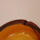 Vintage Italian round ashtray in thick amber glass – Ø 15 cm
