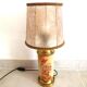Old ceramic lamp "Lunéville" with a pig bladder shade.