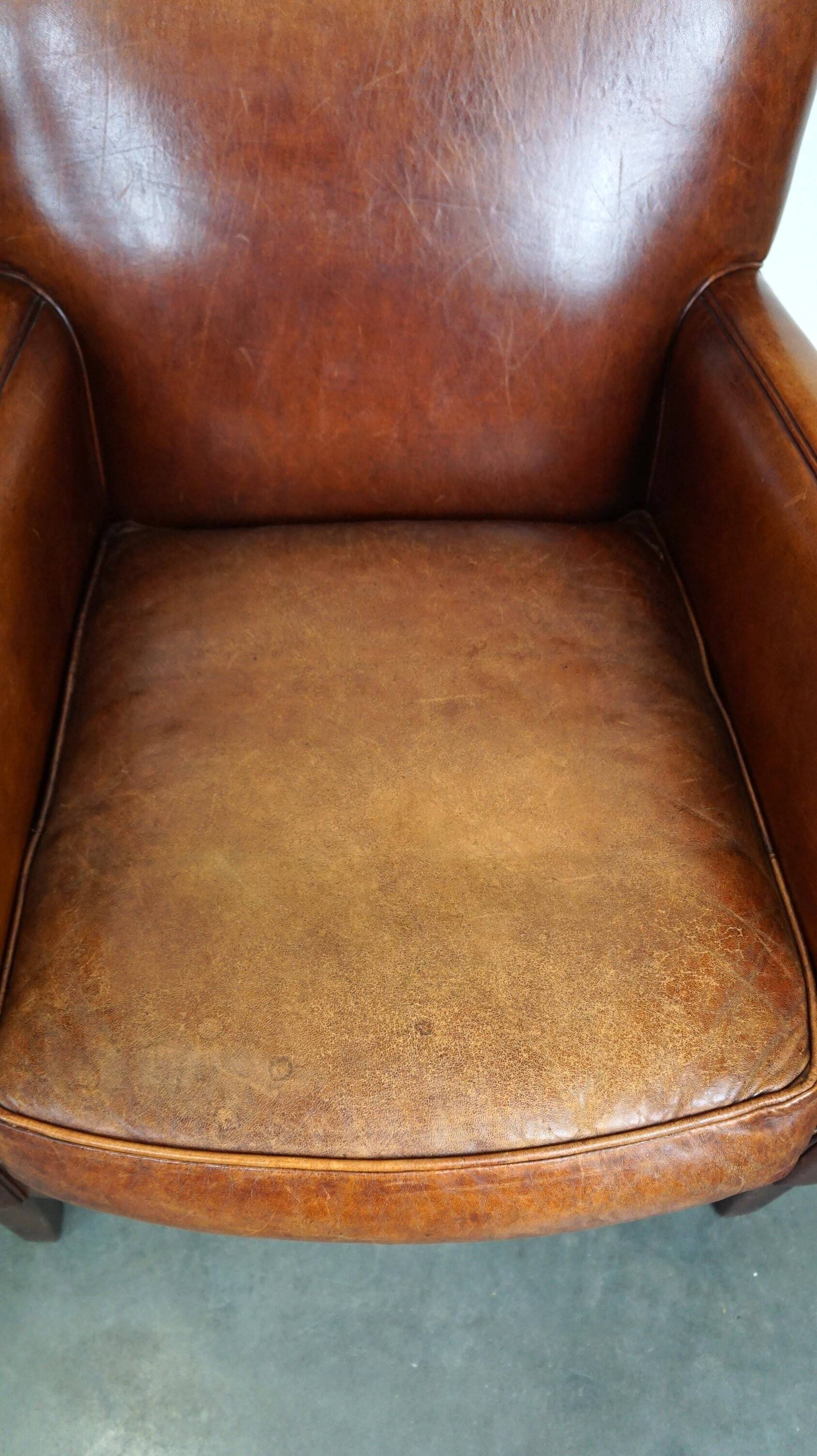Set of 2 subtle sheepskin leather armchairs with a beautiful warm color scheme