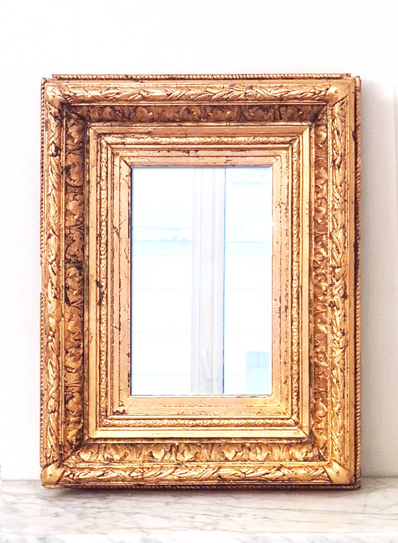 Napoleon III mirror, Wood and stucco, Gilded with copper leaf.