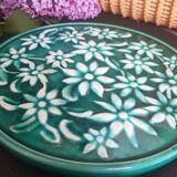 Dessous de plat vert à fleurs