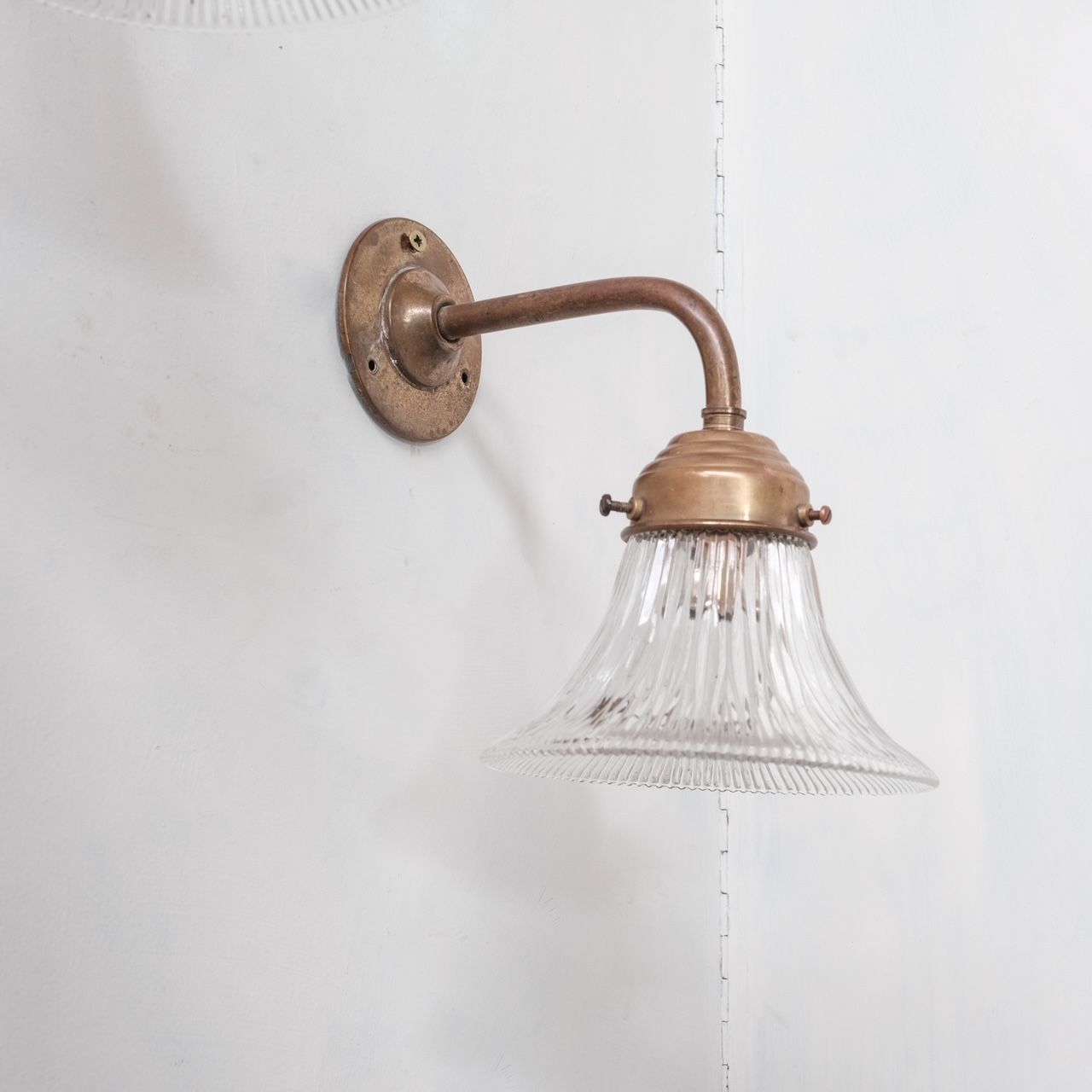 Pair of brass and holophane glass french mid-century wall lights