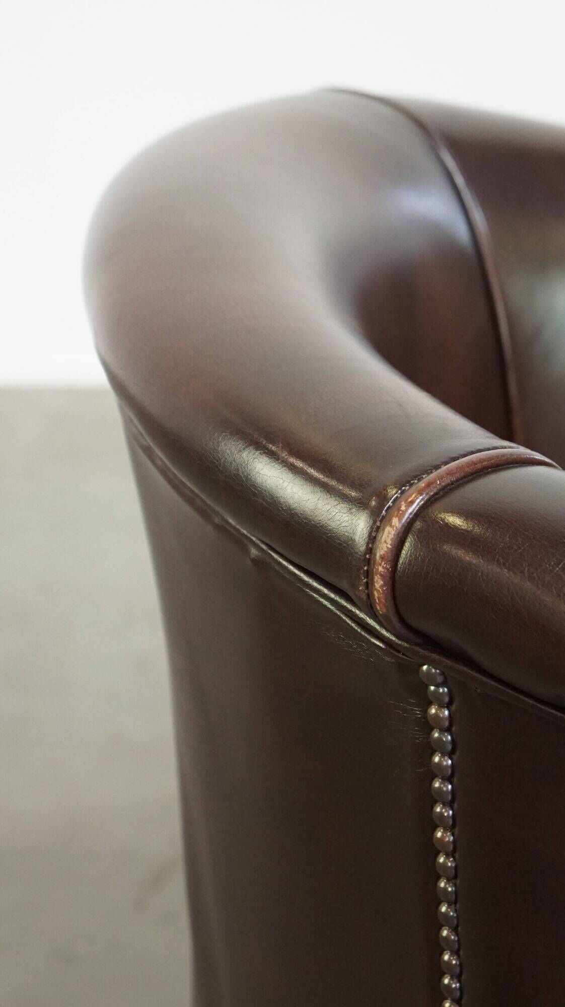 dark cowhide club chair in English style