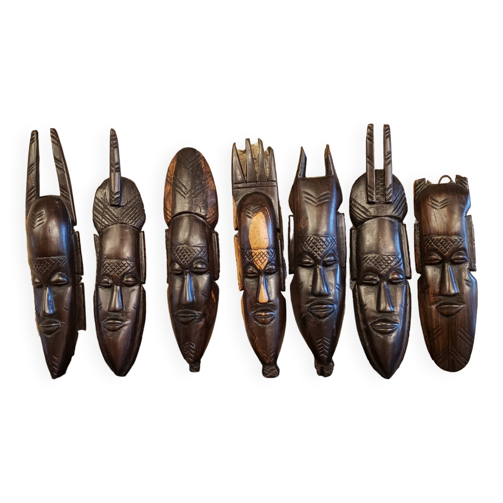 7 weekly African masks in carved wood