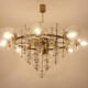 Large chandelier in gilded brass with decorative balls. 1970s.