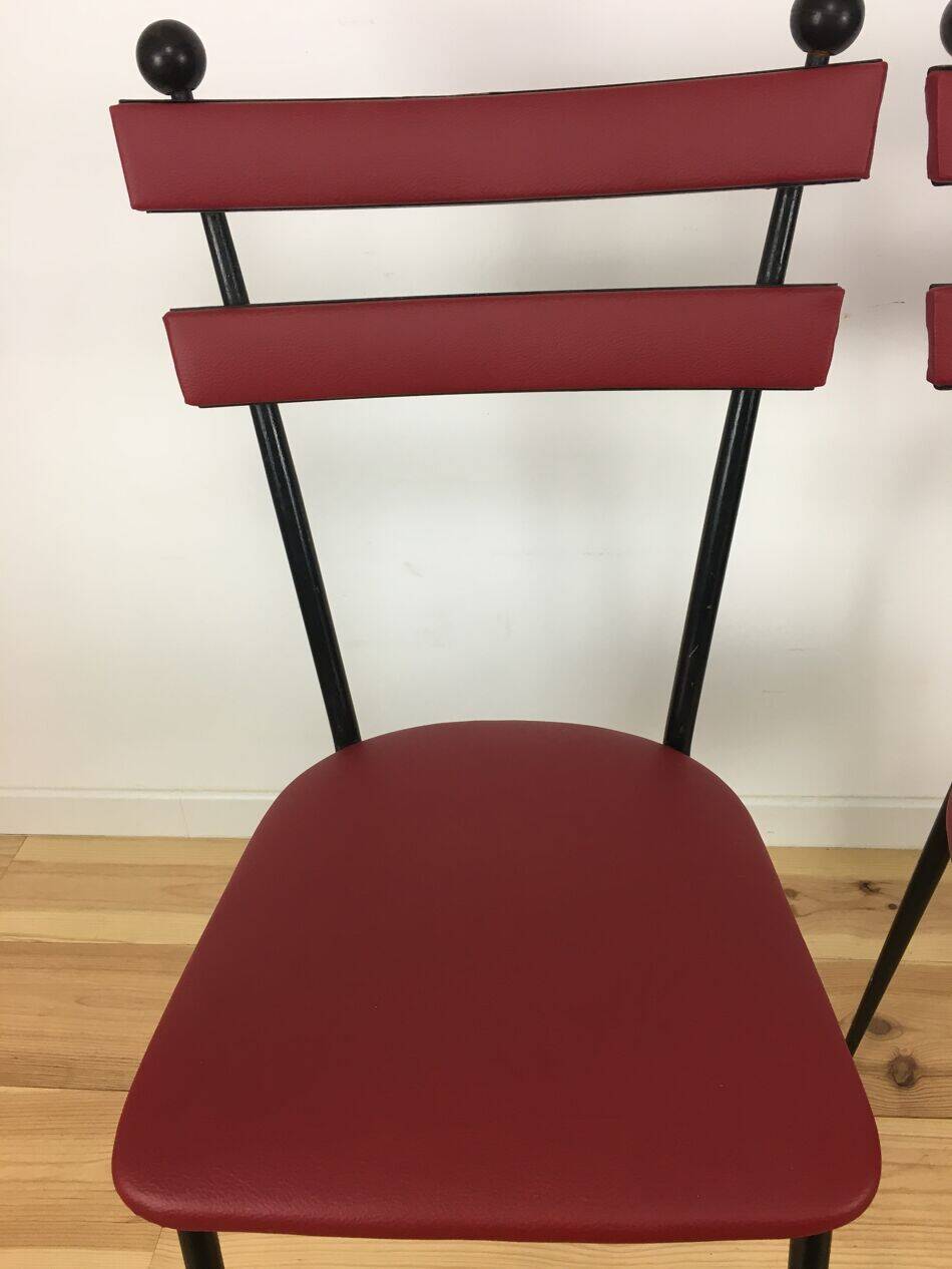 Pair of 1950s chairs in metal and red faux leather, Gueden-Adnet style.