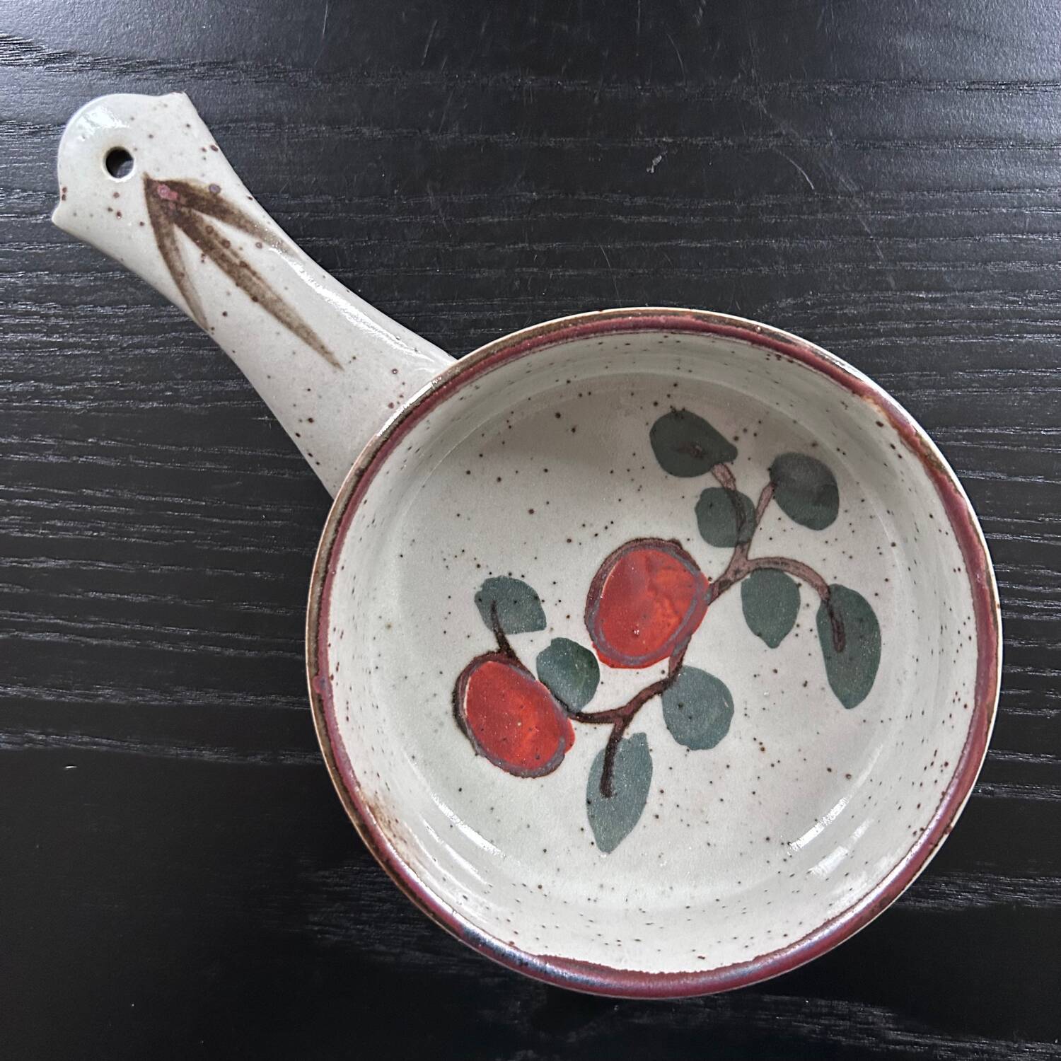 Frying pan with red fruit decoration