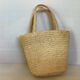 Old woven straw basket embroidered raffia