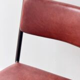 Pair of vintage stacking chairs with red vinyl upholstery