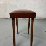 Small stool or footrest in wood and leather