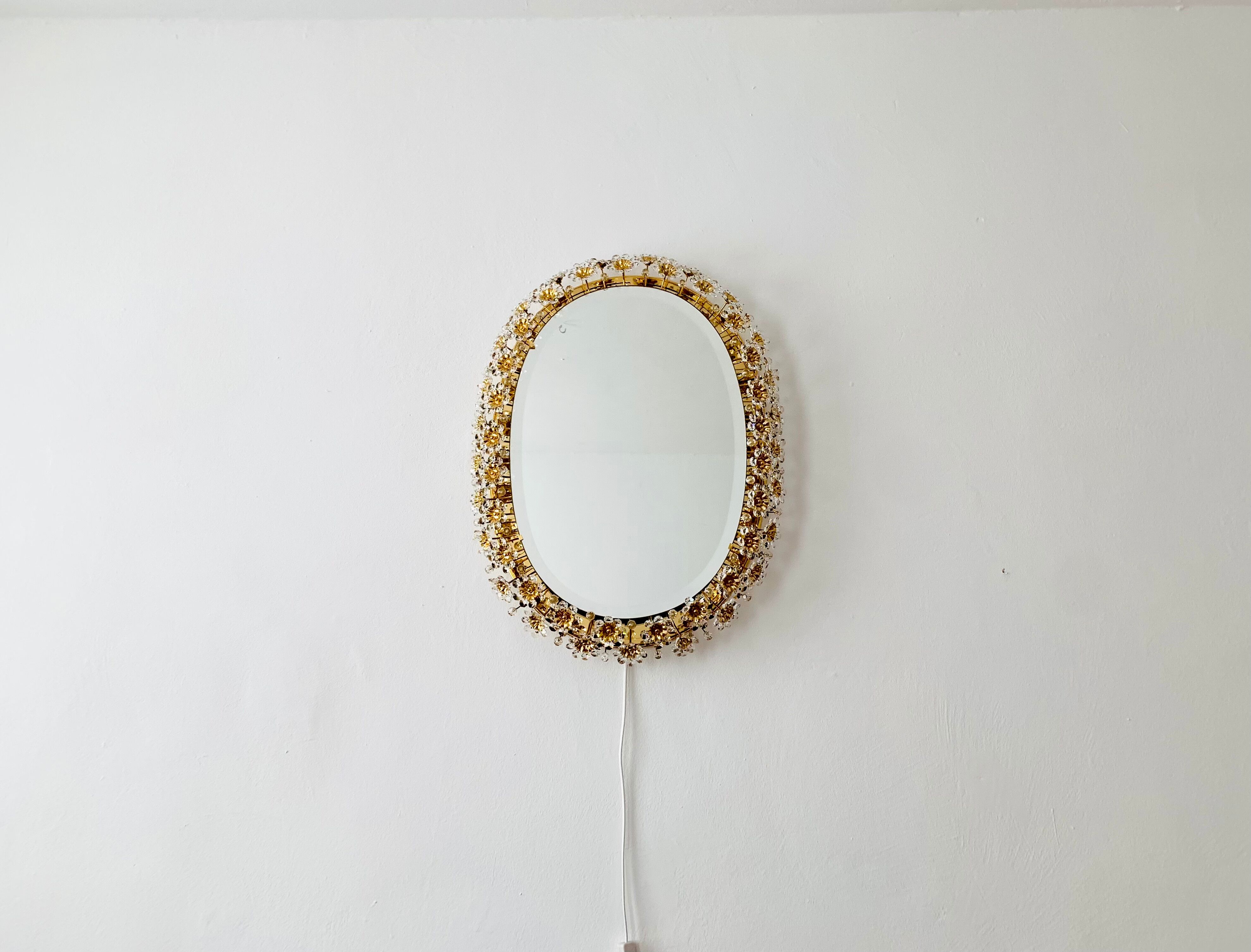 Illuminated floral mirror by Palwa