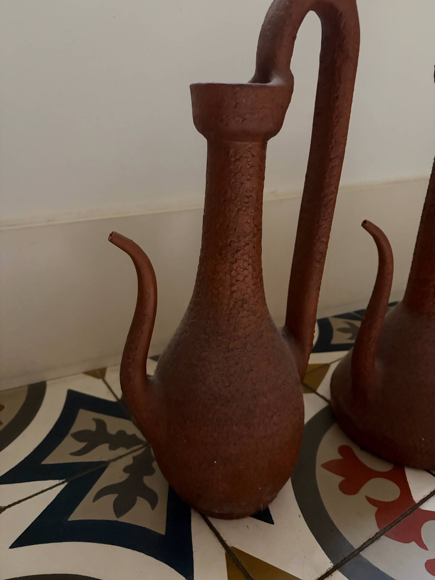 Pair of decorative terracotta jars, in the shape of a ewer.