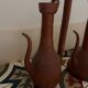 Pair of decorative terracotta jars, in the shape of a ewer.