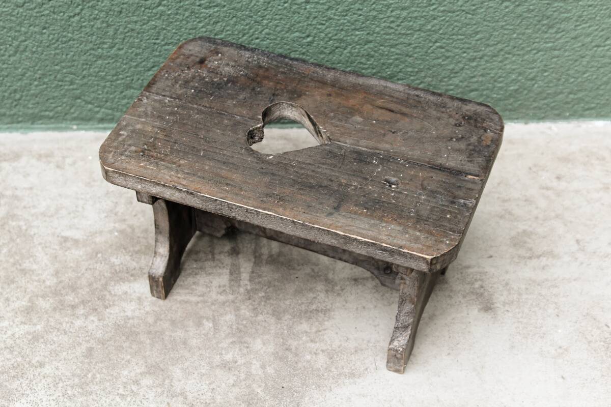 Wooden footrest, heart cutout