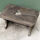 Wooden footrest, heart cutout