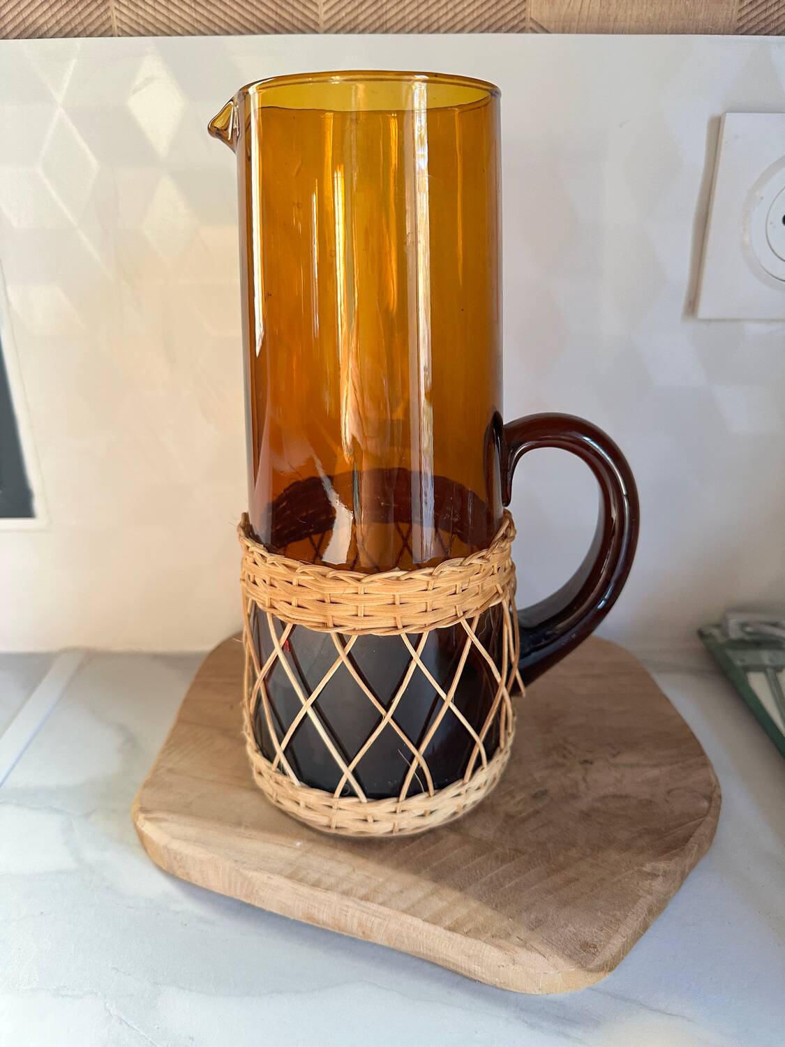 Vintage orange and wicker carafe