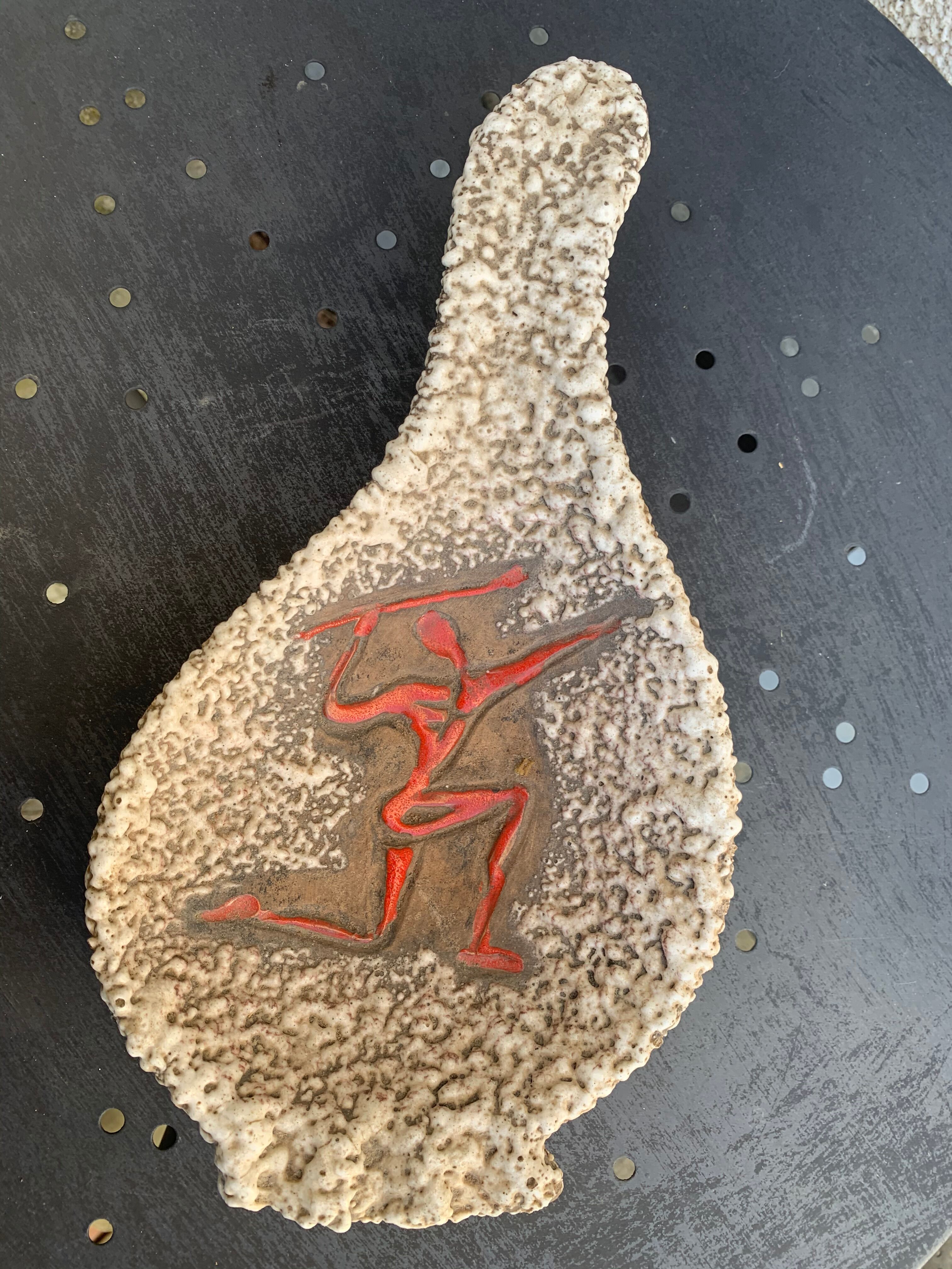 Glassed ceramic cut enamelled prehistoric warrior motif vintage red 1950