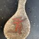 Glassed ceramic cut enamelled prehistoric warrior motif vintage red 1950