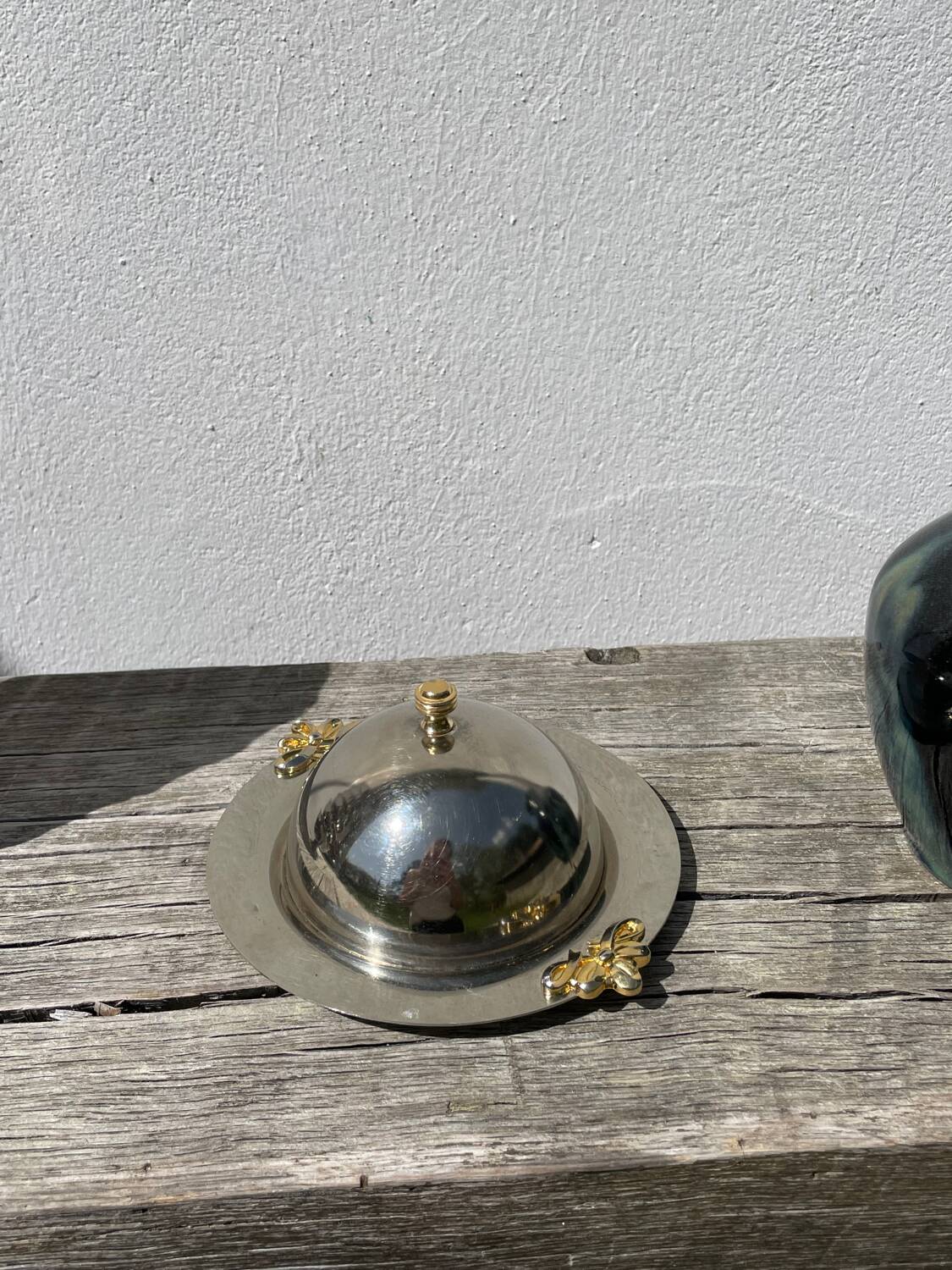 Silver-plated metal butter dish with knots