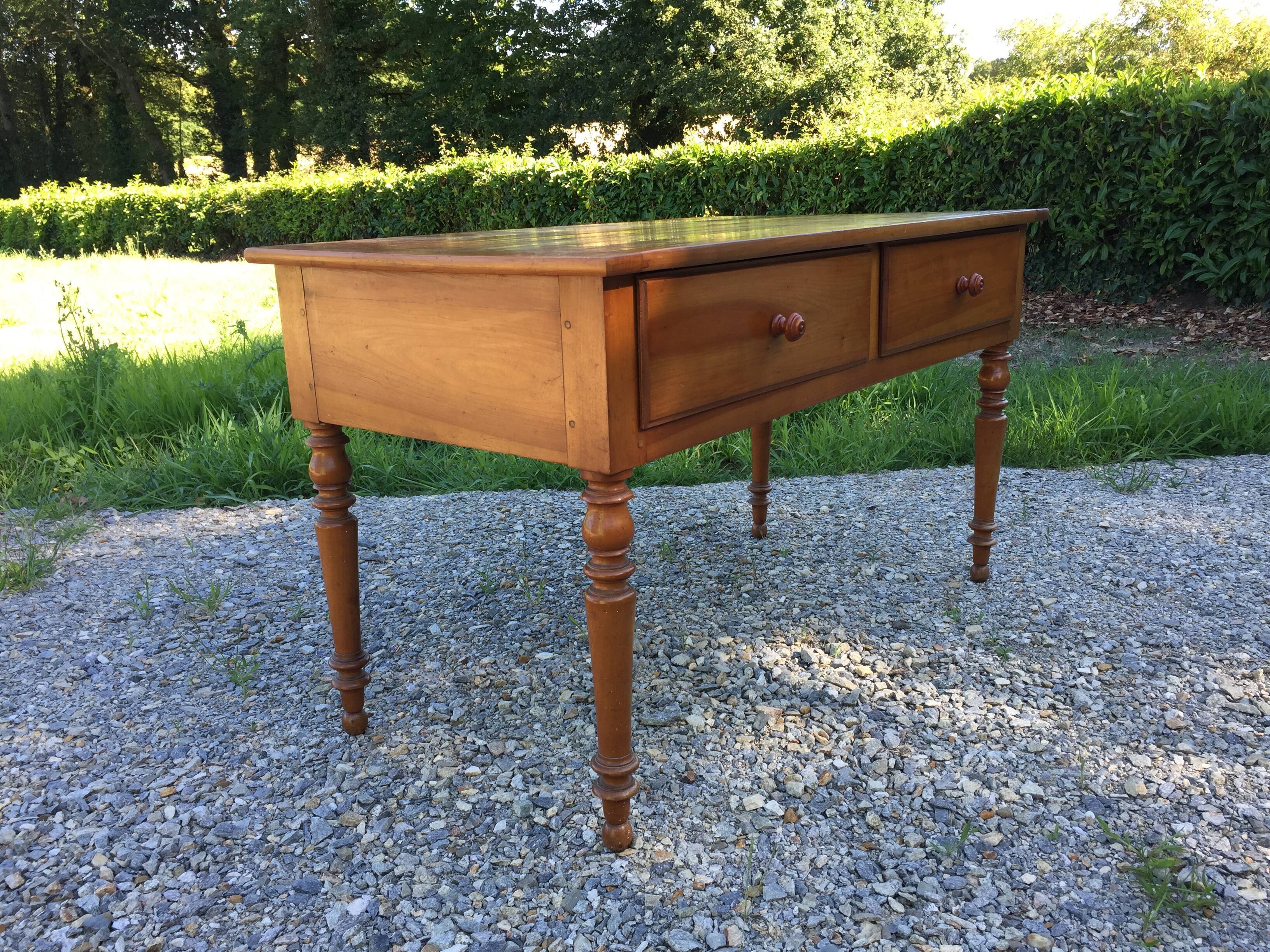 Old farmhouse table louis Philippe style in solid cherry with turned feet.