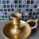 Two brass hand candle holders