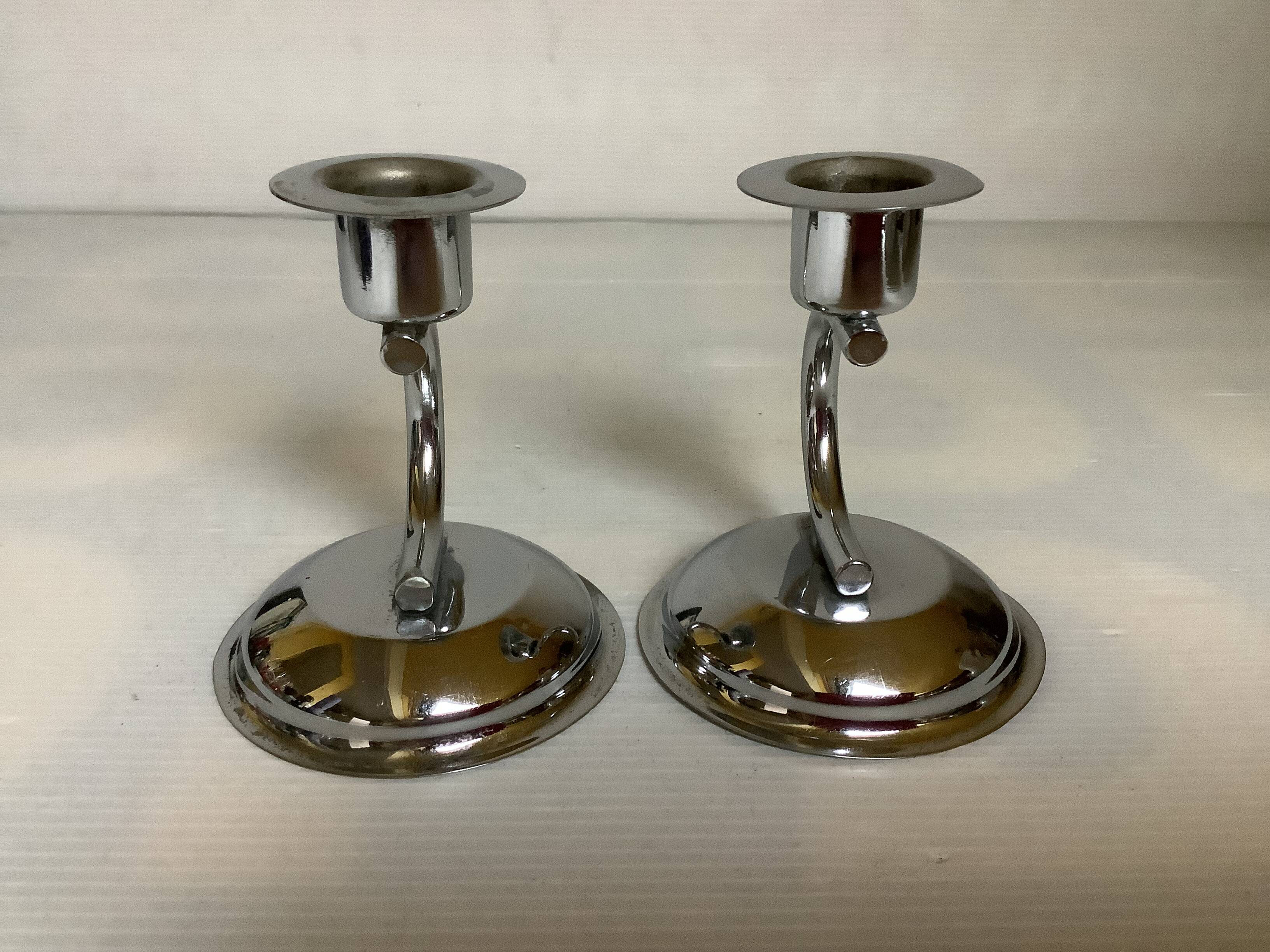 Pair of small silver metal candlesticks