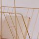 Vintage golden magazine rack
