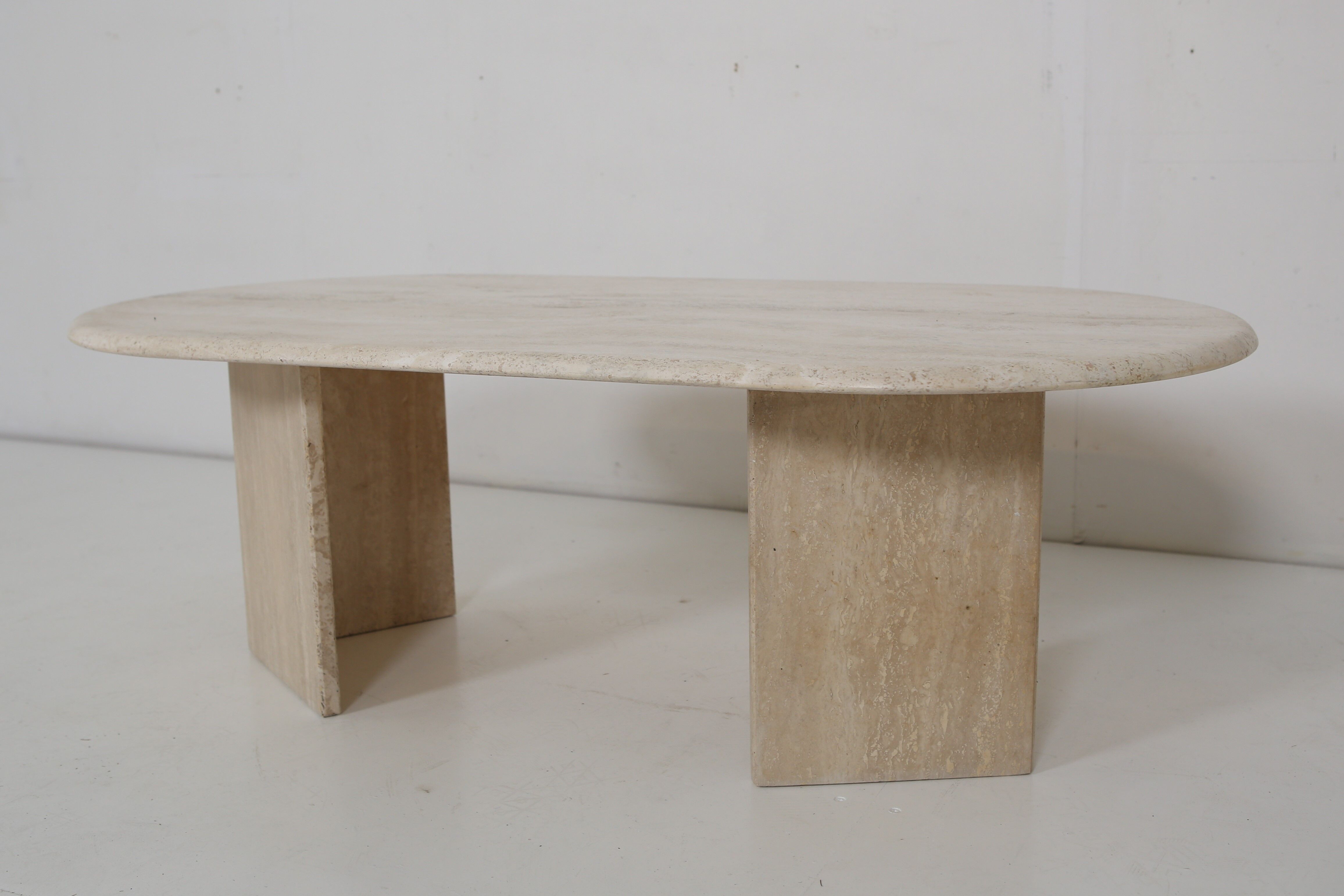 Oval travertine coffee table