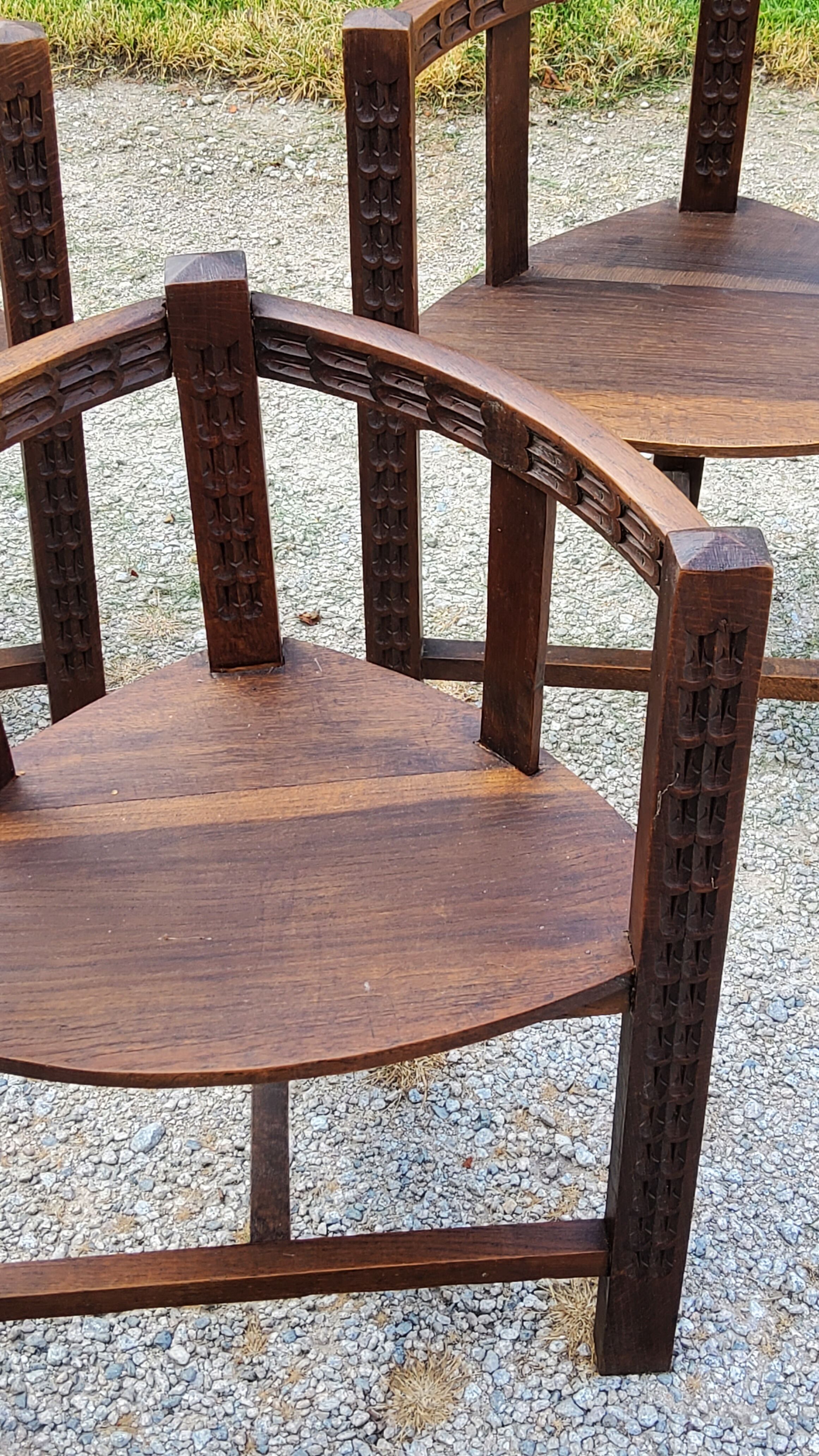Set of three brutalist tripod armchairs in carved solid oak