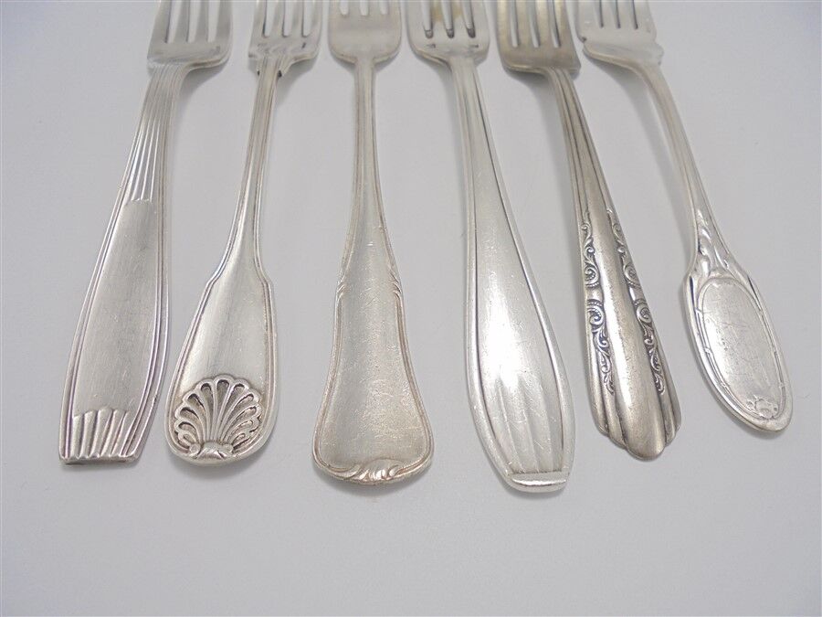 6 old mismatched forks