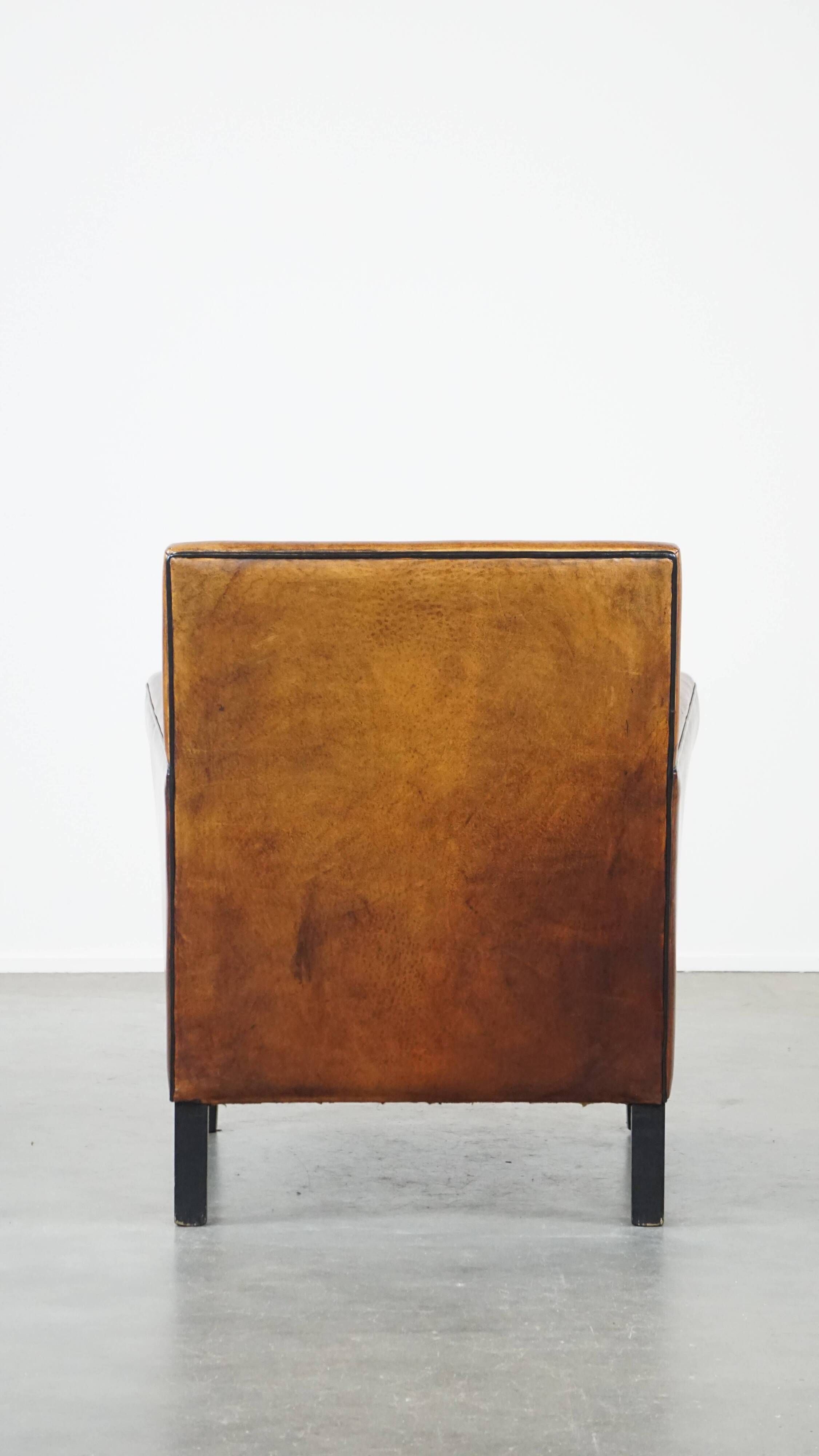 Cognac-colored sheep leather Art Deco design armchair finished with piping