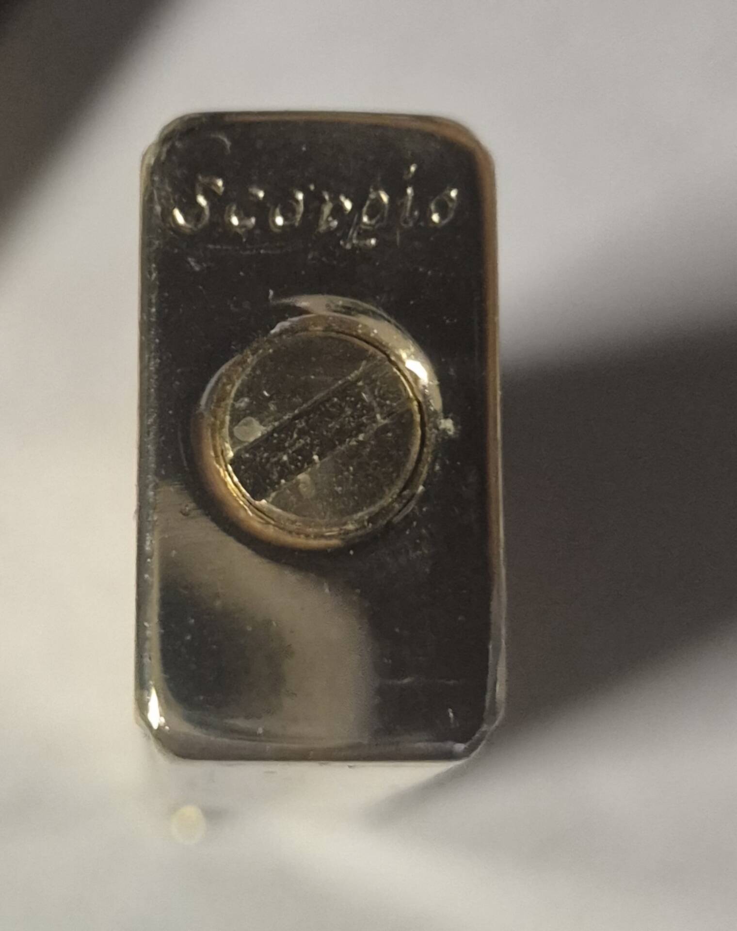 Vintage Scorpio gas lighter in its collector's case.
