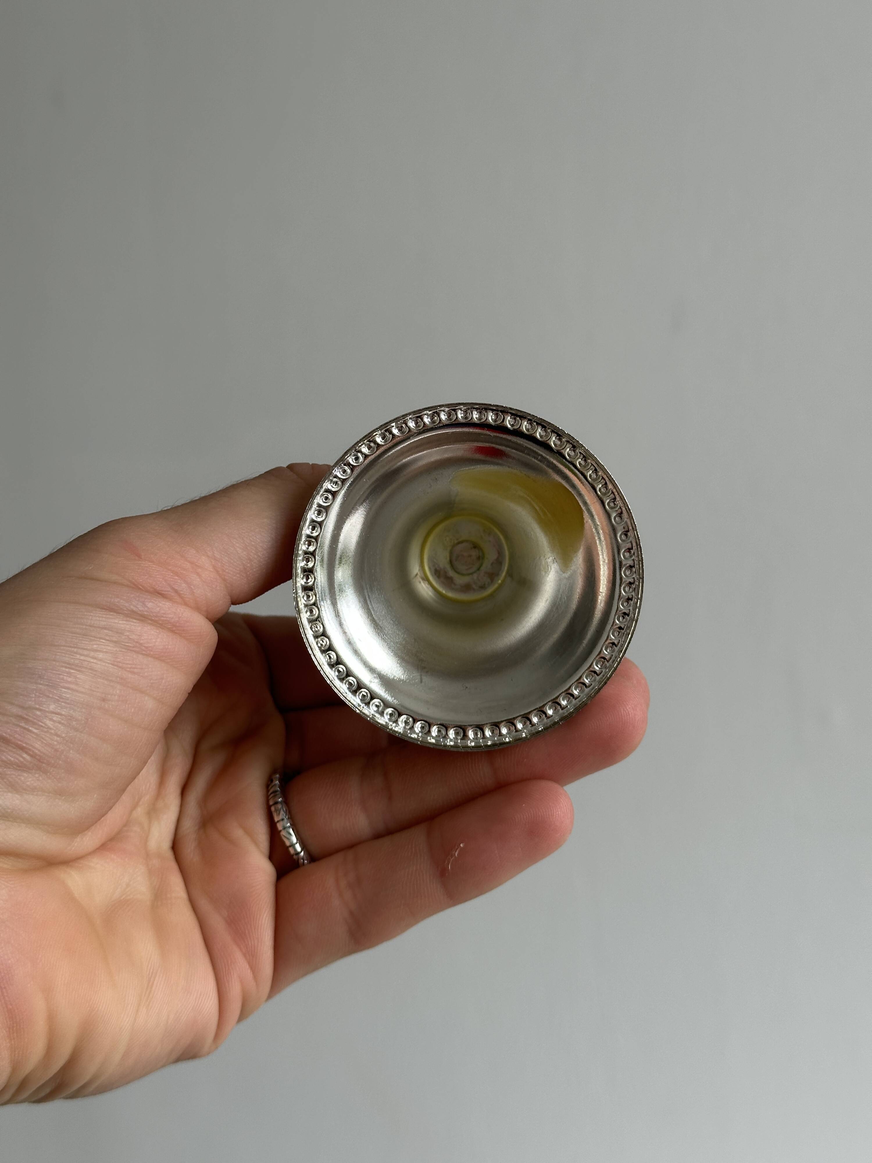 Pair of small light metal candlesticks