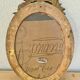 Antique medallion frame in gilded stucco with its period portrait.